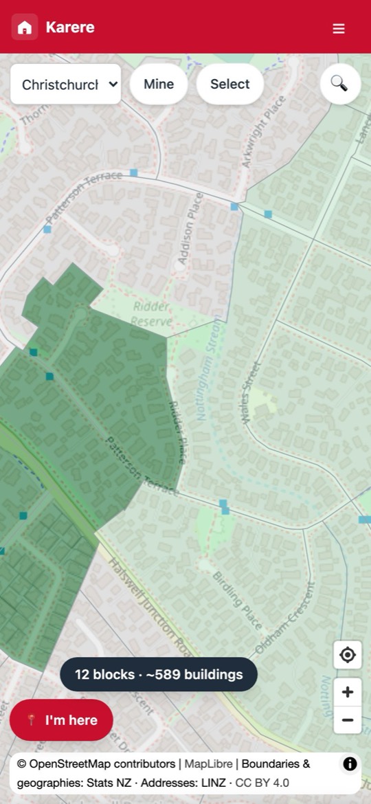 The Karere map mid-campaign: blocks claimed by volunteers in amber and finished blocks in green, sitting next to untouched streets in grey.